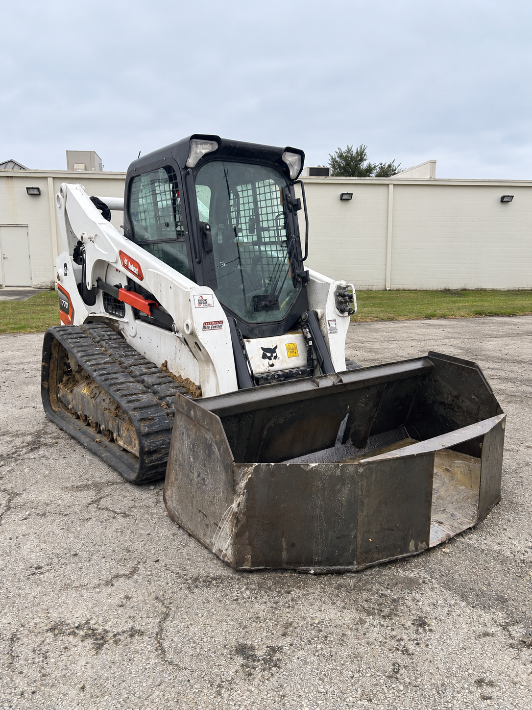 Compact equipment with a bucket attachment